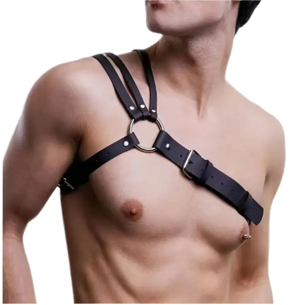 A man wearing a leather harness that rides over one shoulder.