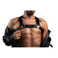 Black leather chest harness worn over shoulders and under arms, modeled against a white background.