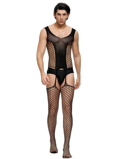 Man wearing a black fishnet bodysuit and stockings on a white background